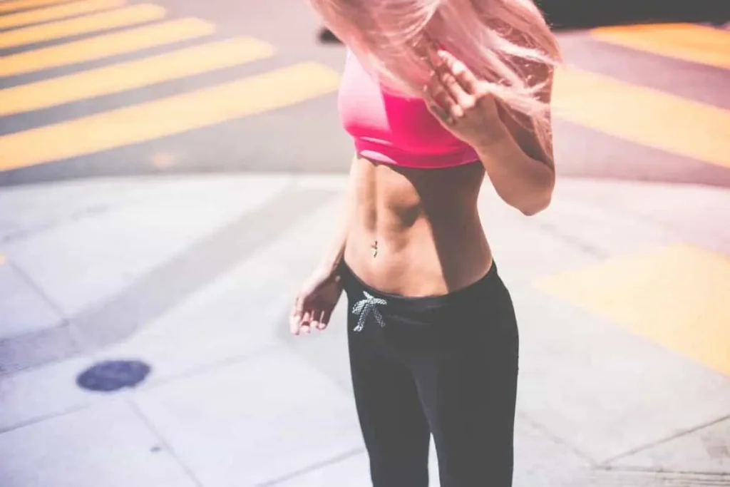 Woman with toned stomach after LA-EMS Body Sculpting Treatment