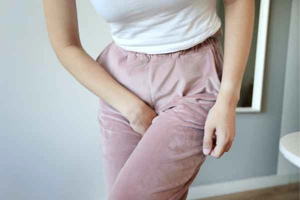 woman running for the toilet because of urinary incontinence